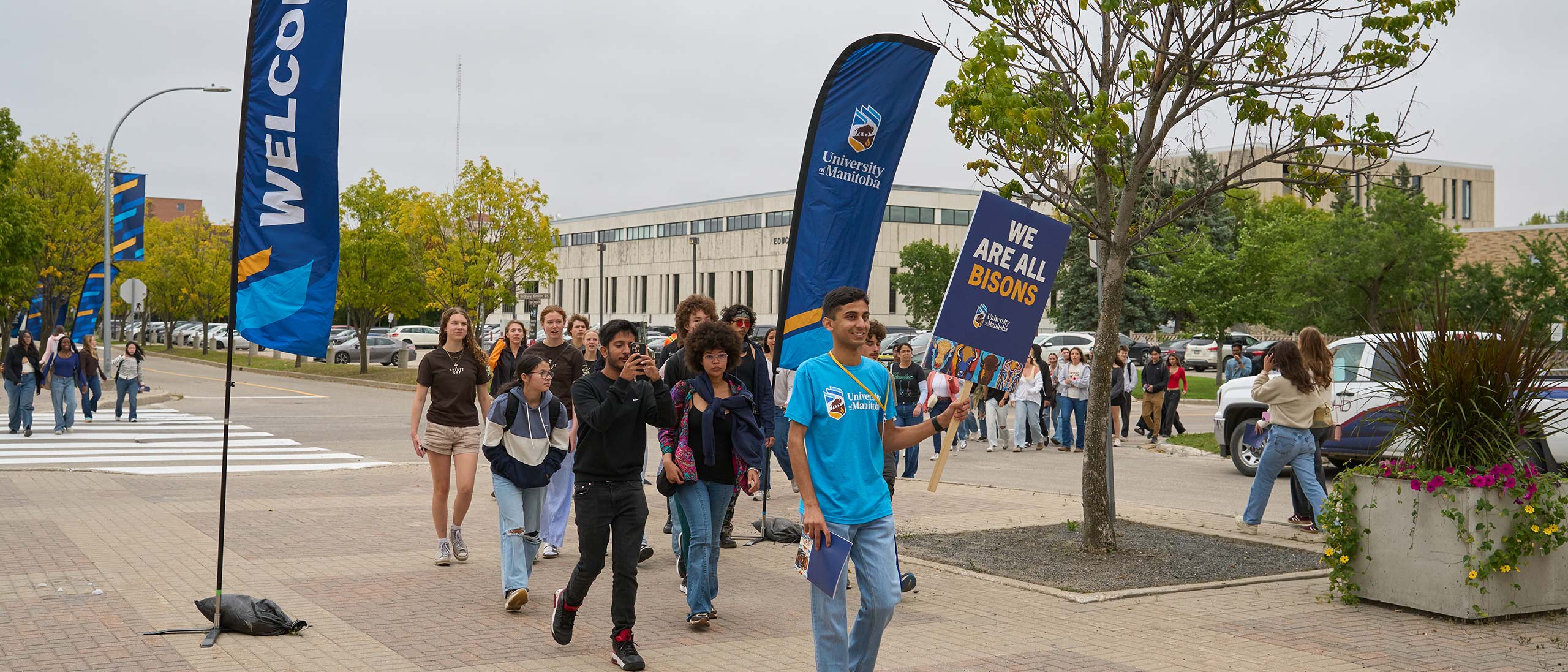 New students follow a volunteer leader during 2025 welcome day into IGAC