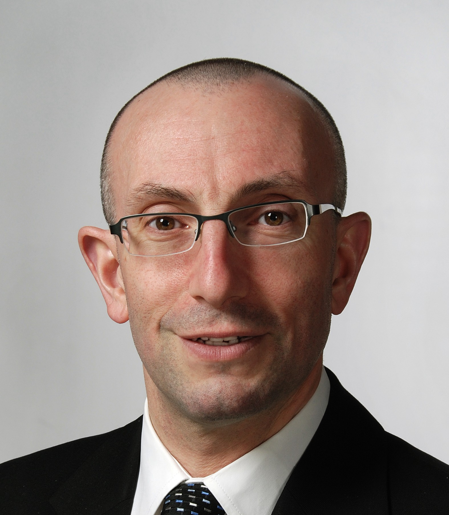 a headshot of Dr. John Embil