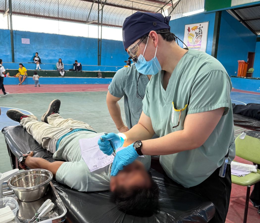 Allen Kim treats a patient.