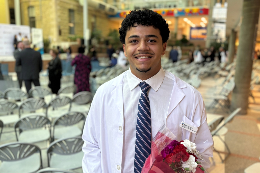 Portrait of Omar Elmatary wearing a white coat.