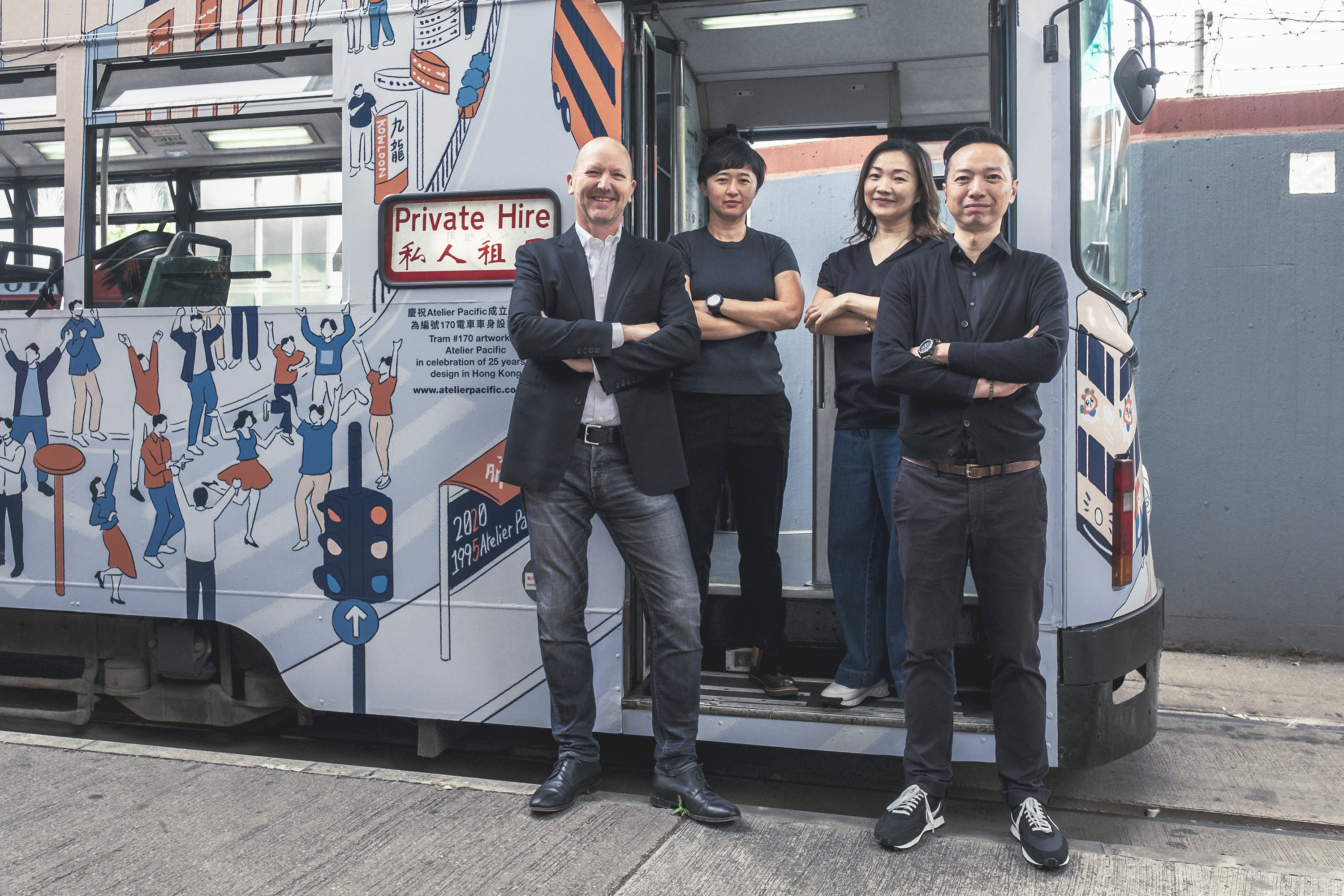 Four people stand confidently in front of a decorated tram labeled "Private Hire," showing teamwork and professionalism. The tram features playful, colorful illustrations.