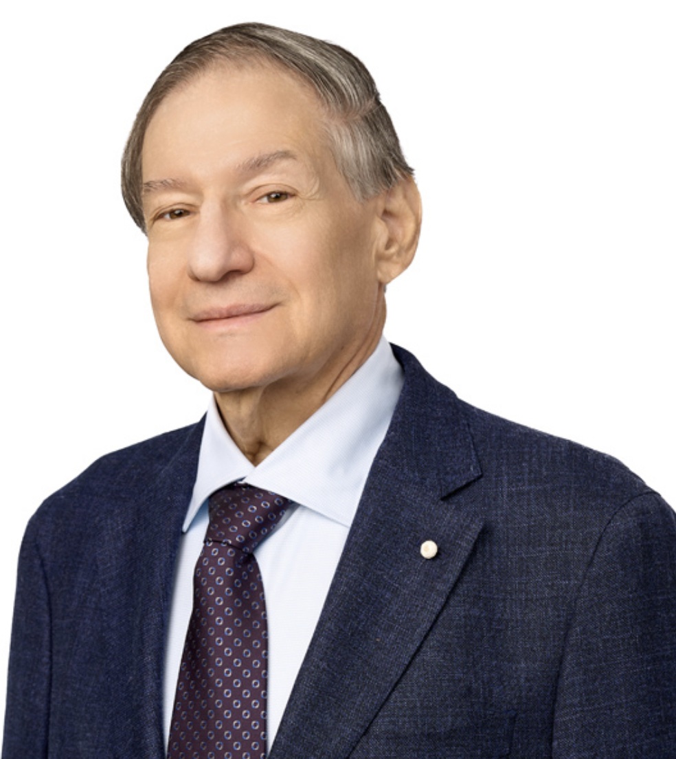 headshot of a man in a suit jacket, white dress shirt and tie.