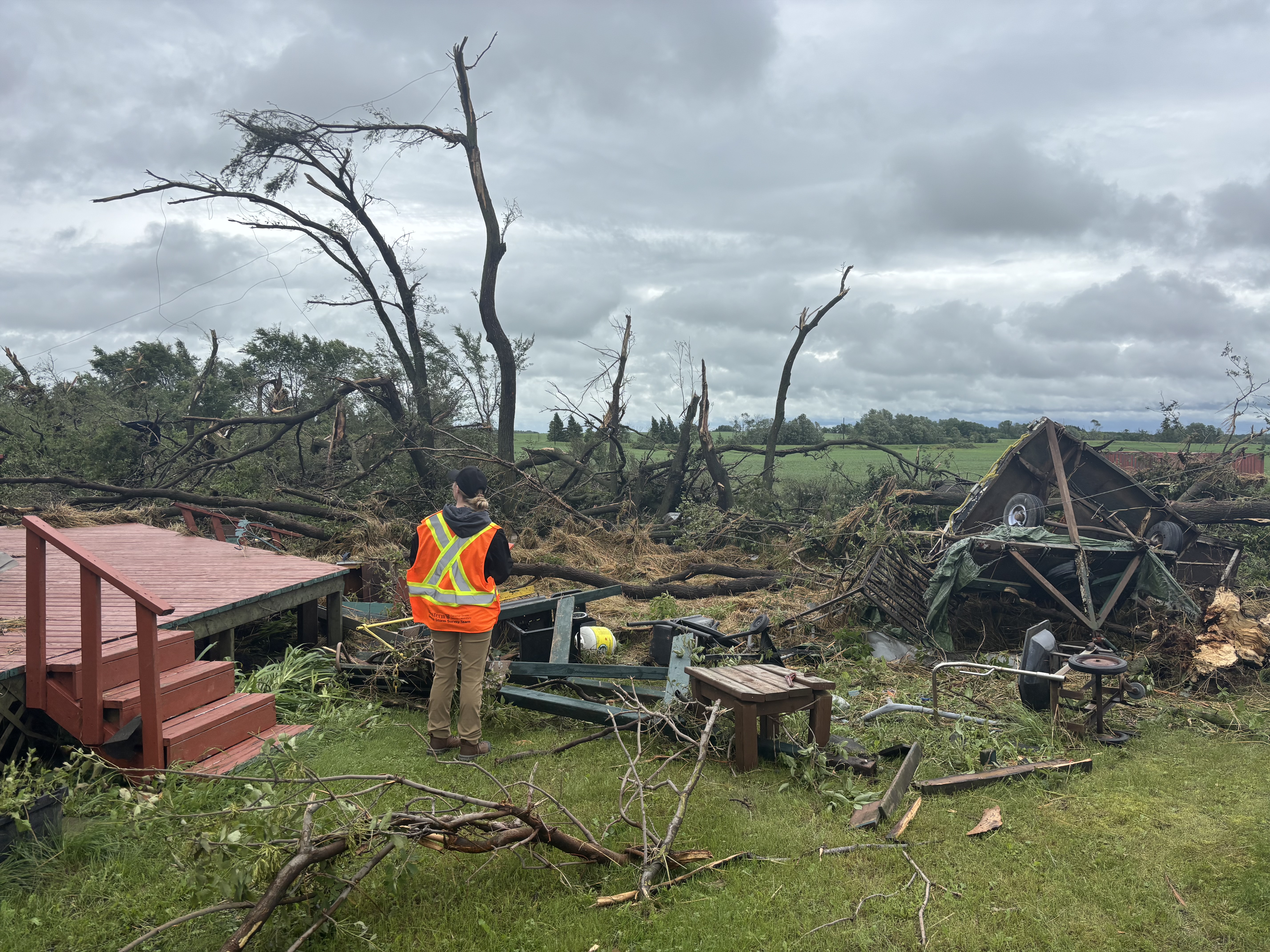 researcher looking at storm aftermath