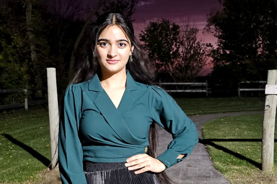 Inderdeep Kaur celebrates earning her Certificate in Management and Administration.