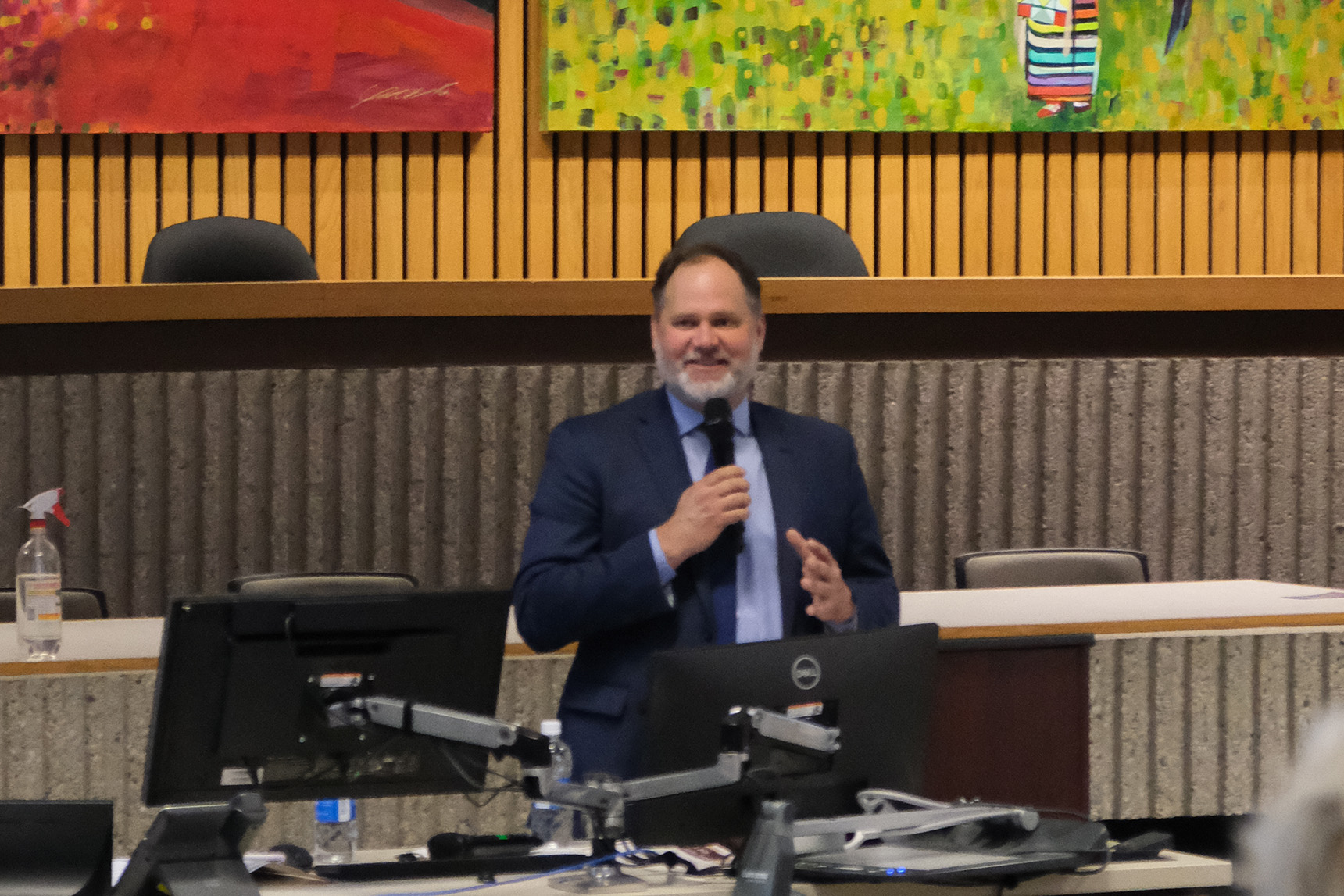 Manitoba Minister of Justice and Attorney General Matt Wiebe speaks at the front of a wood panelled room