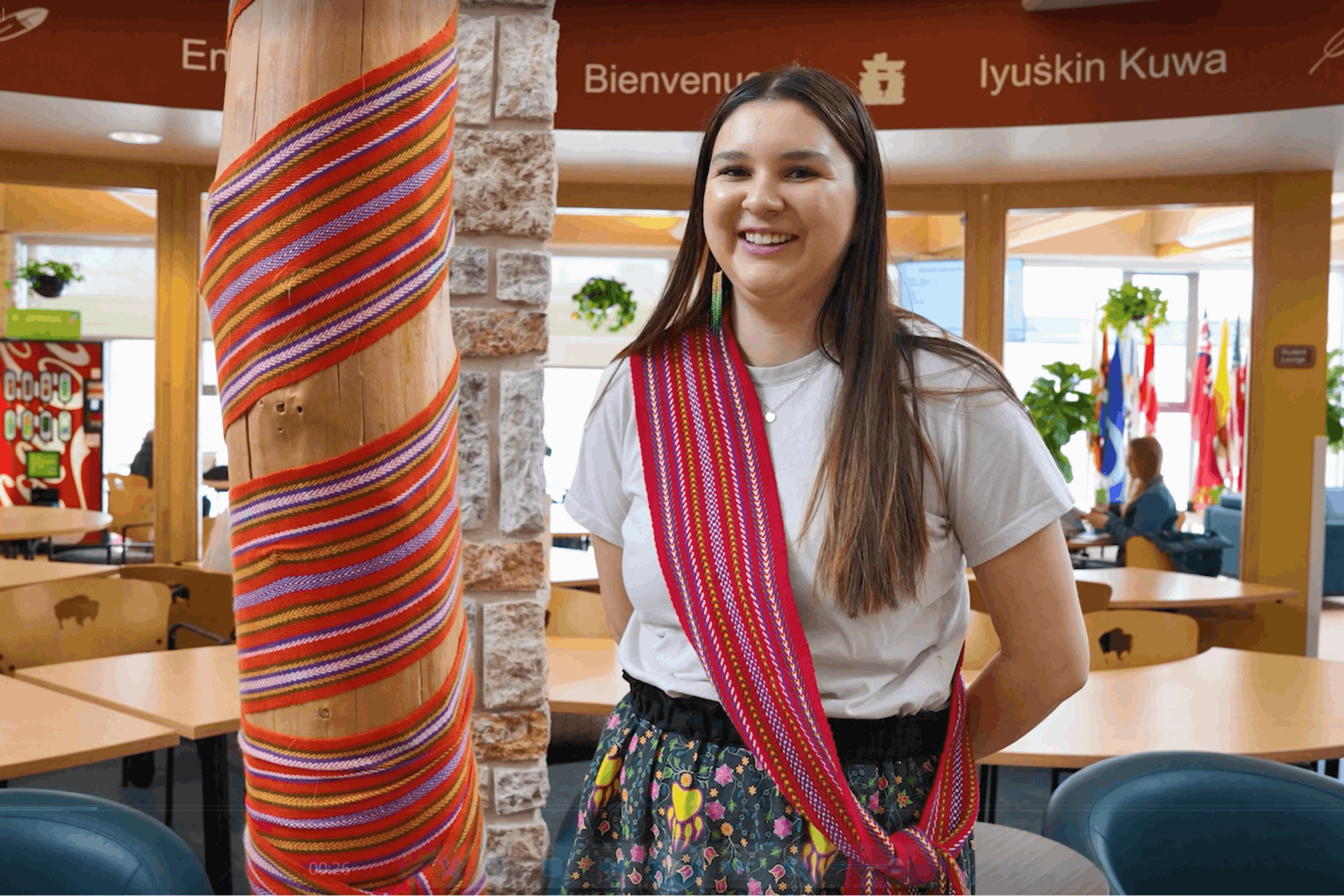 female posing with a smile inside the Indigenous student center at UM.