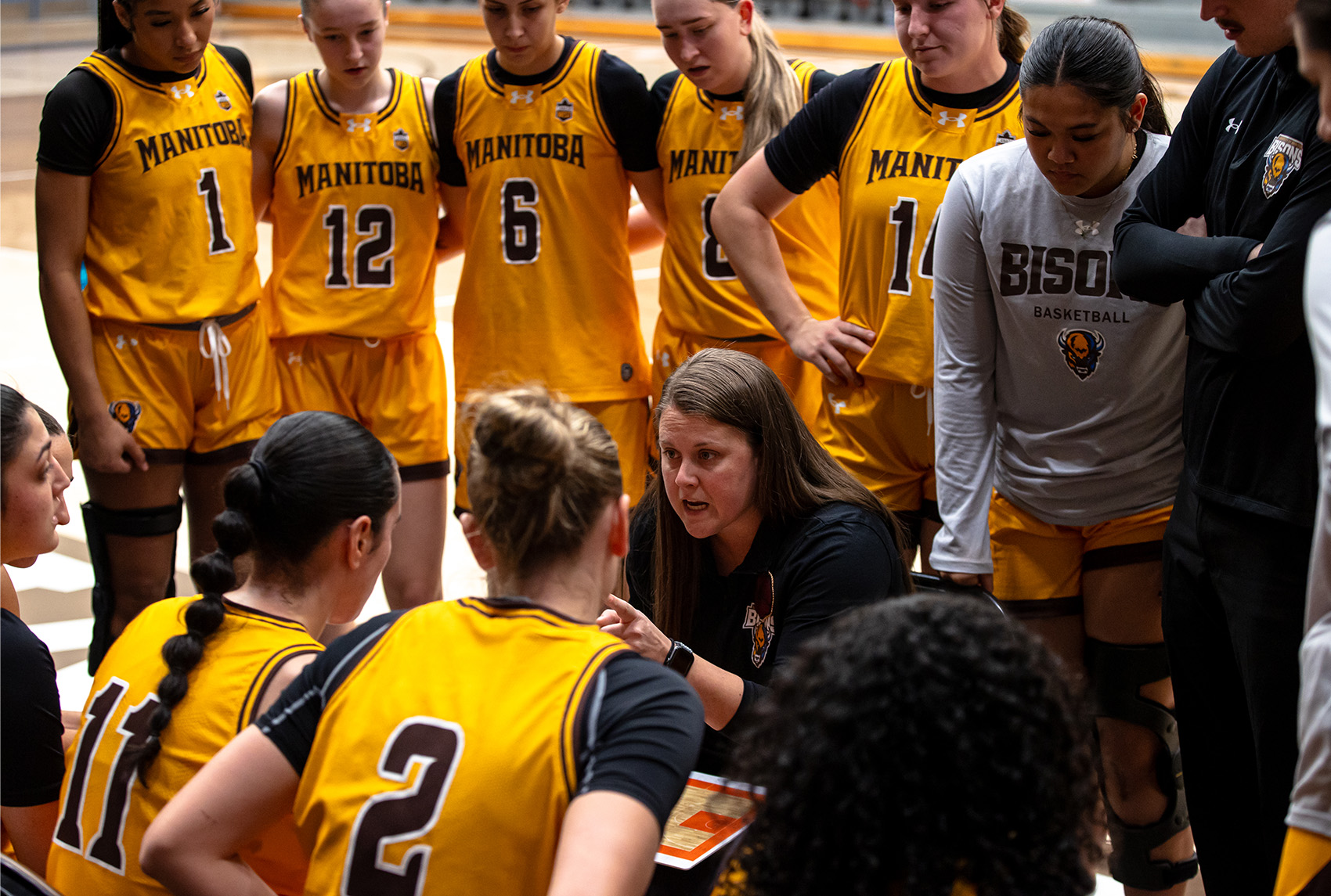 Michele Sung during a time out in a women's basketball game.
