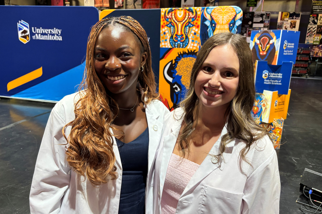 Toni Fatoye and Charlotte Kowall pose for a photo. 