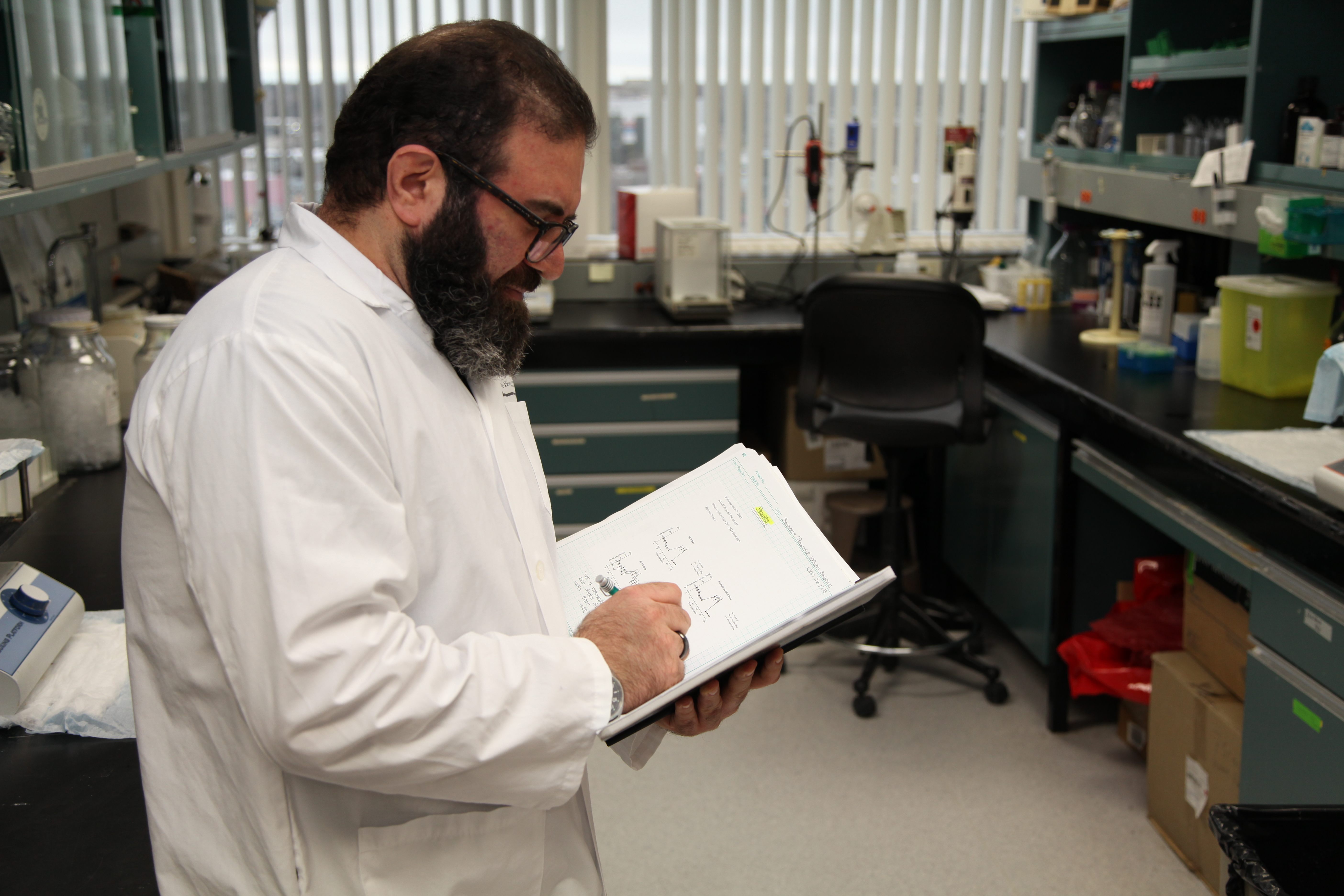 Lab worker reading 