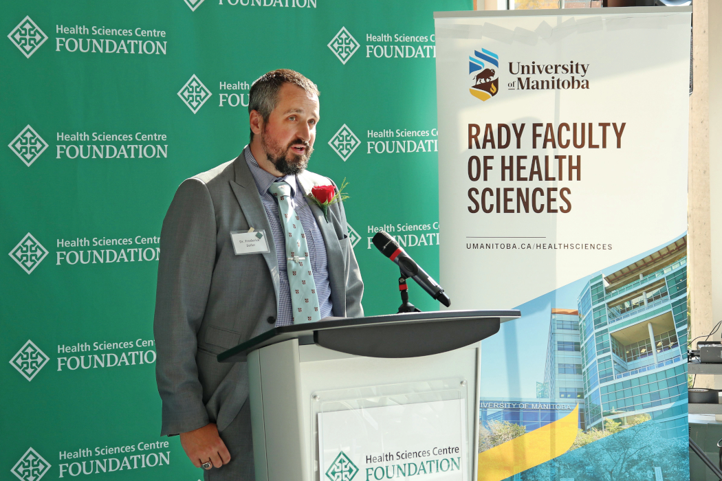 Dr. Frederick Zeiler speaks at a podium. 