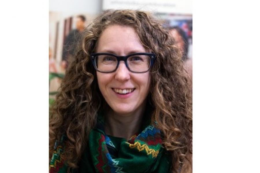 A woman smiling.