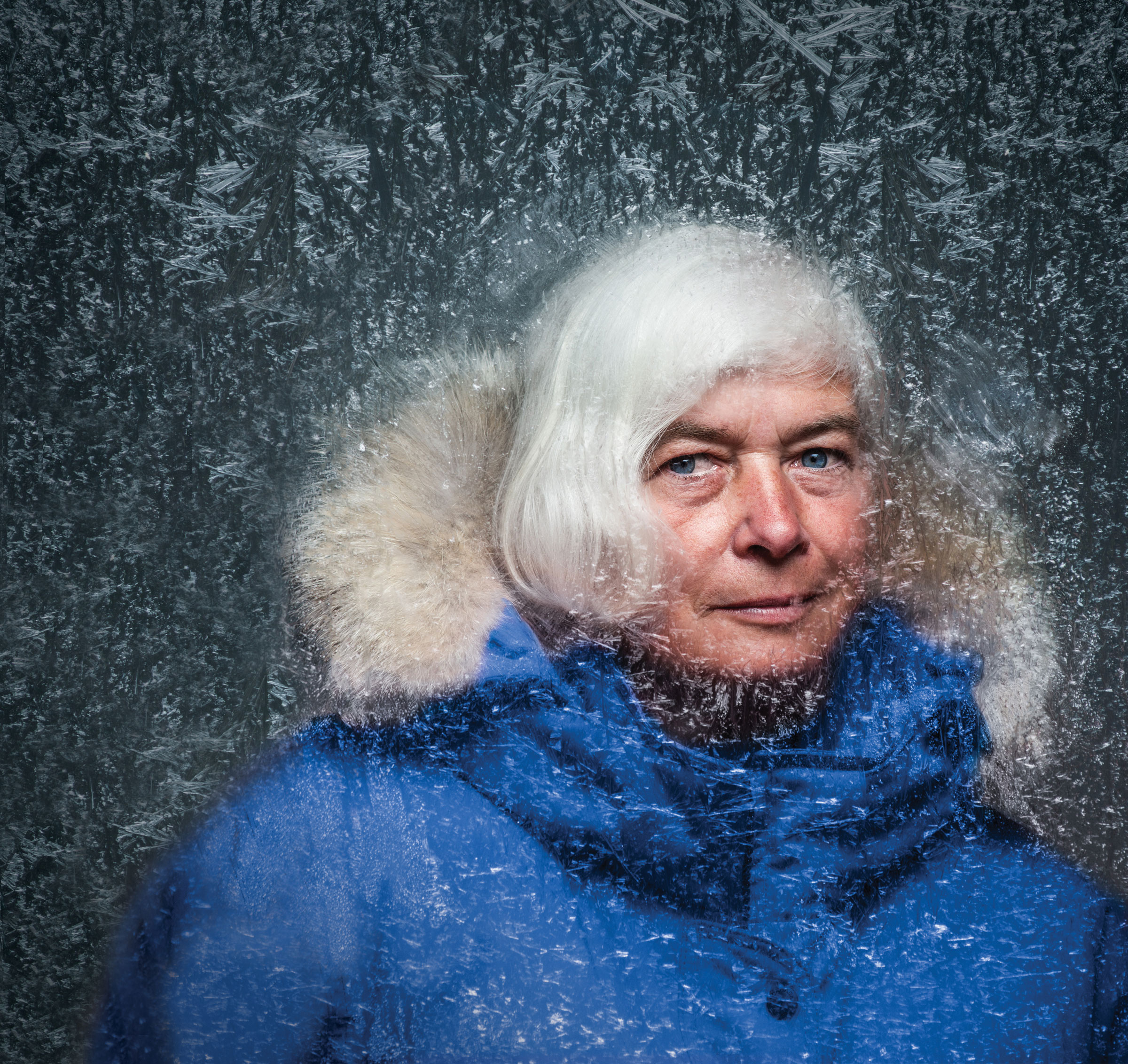Dorthe Jensen in a blue parka, with ice surrounding her face.