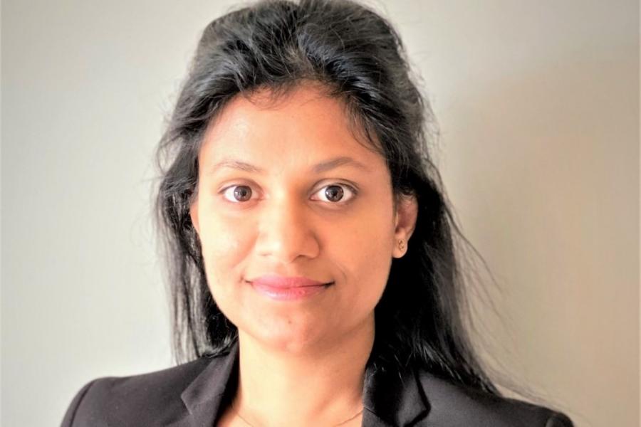 A woman smiling.
