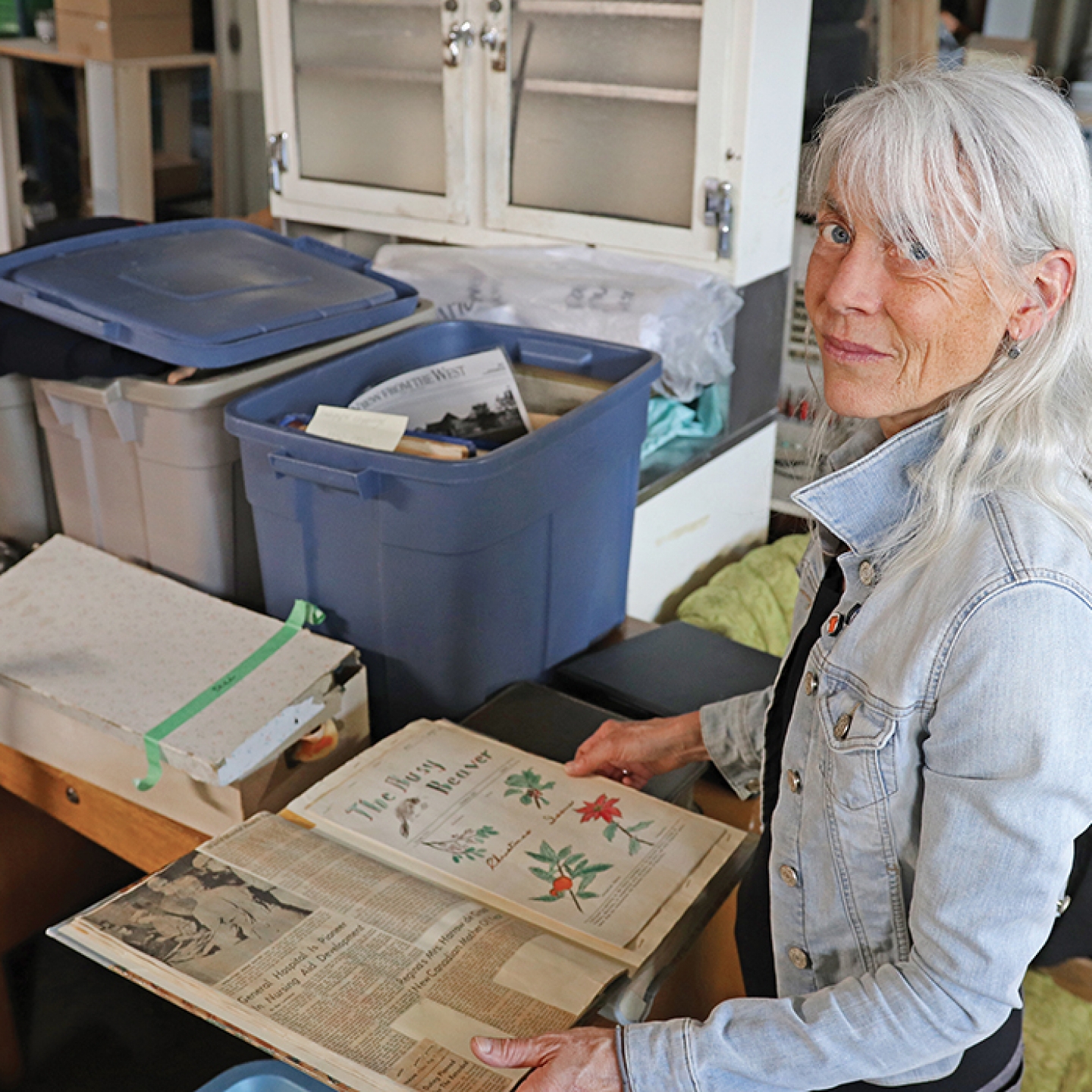 Madeline Burghardt looking through artifacts.