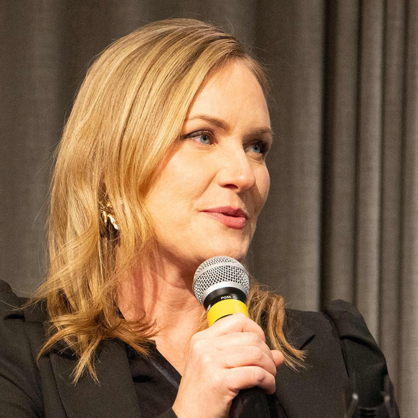 Dr. Mandy Archibald speaks at a conference.