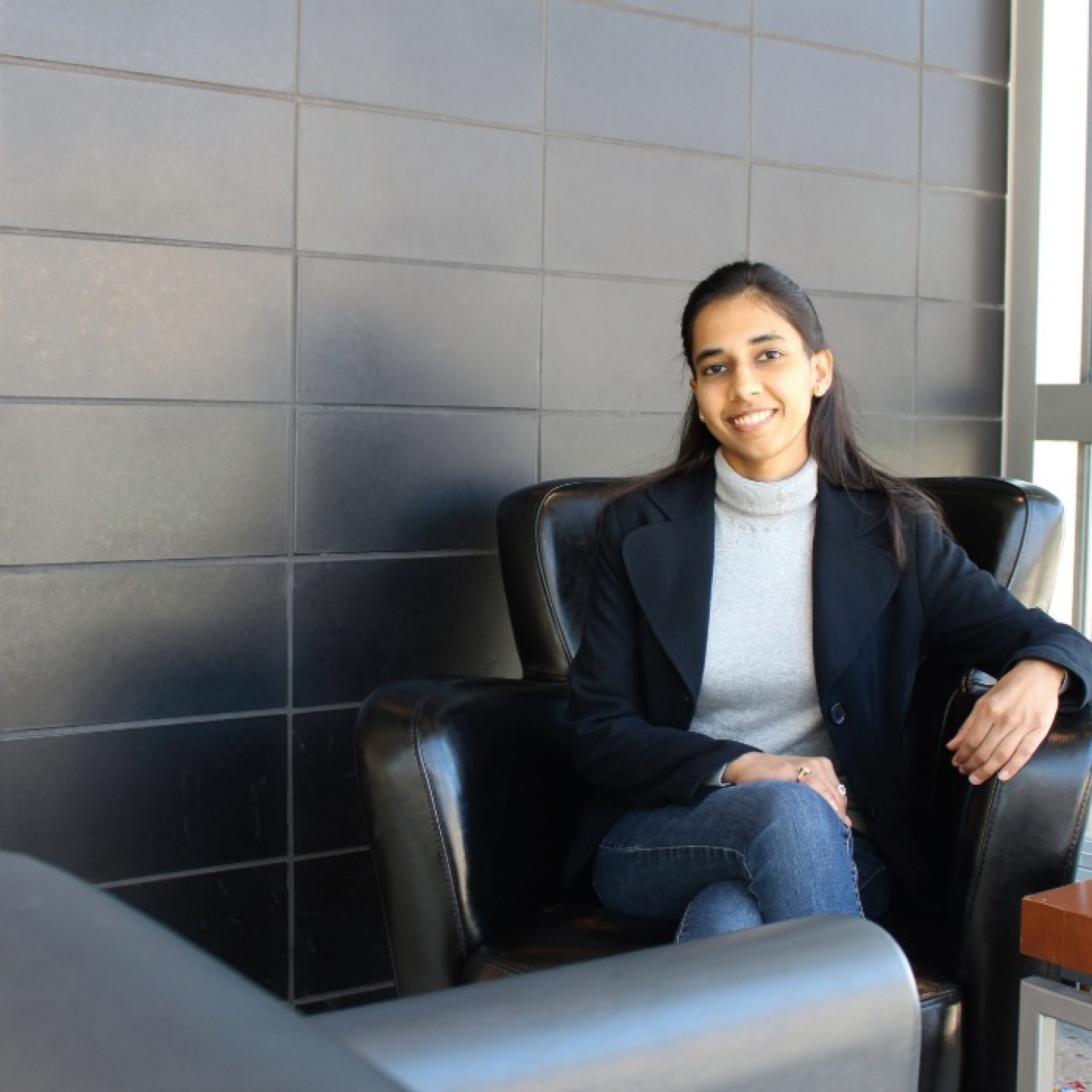 Dr. Shweta Mital sits in a chair. 