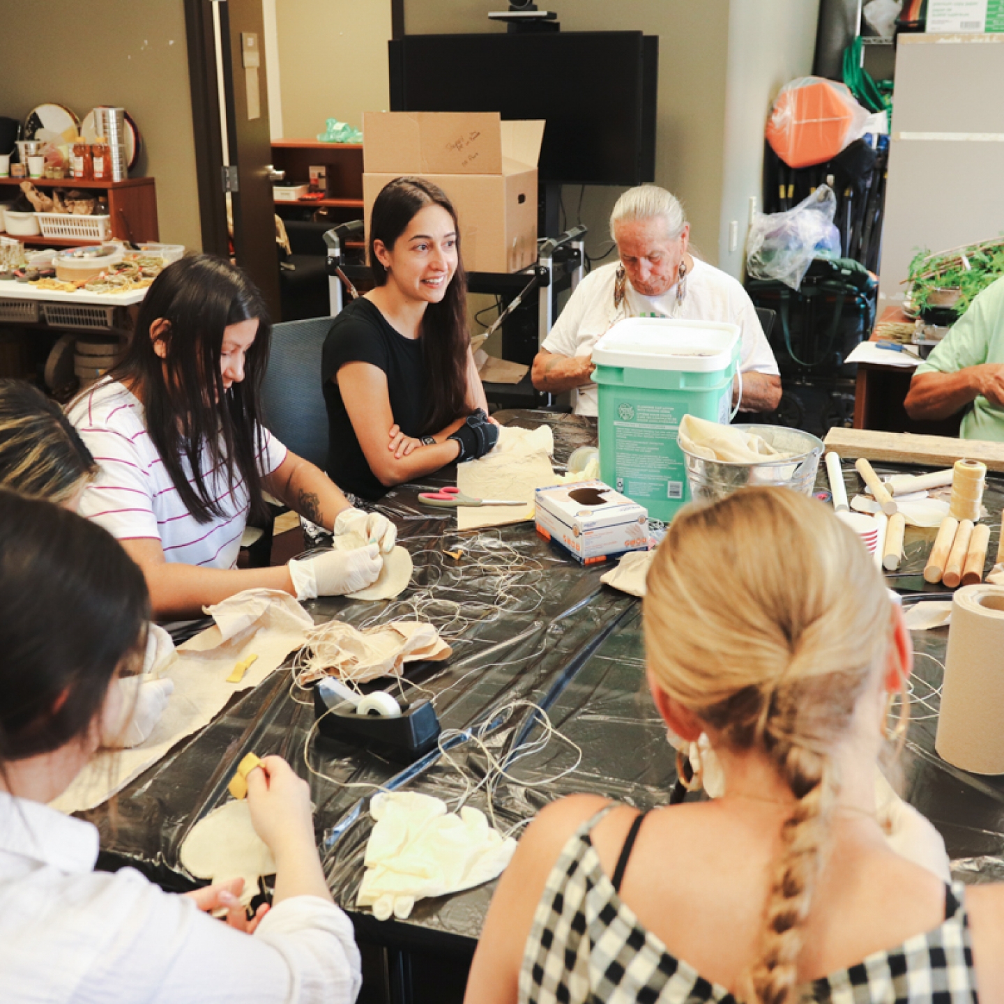 A group of people making rattles.