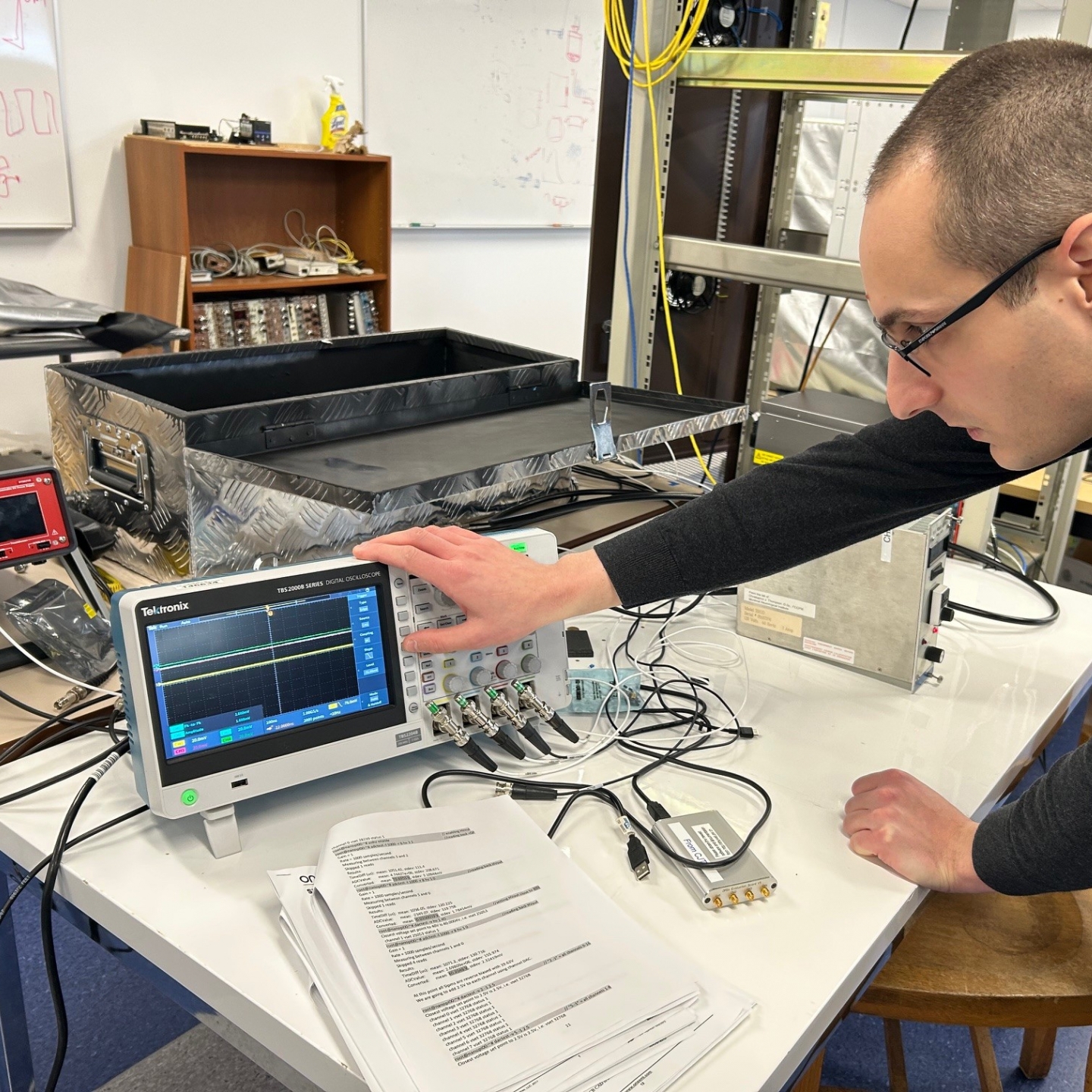 Man operates electronics.