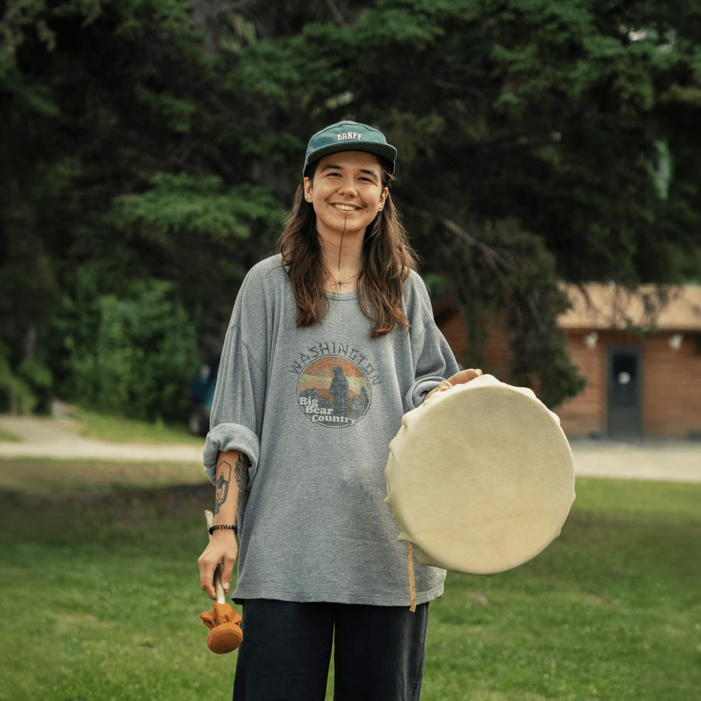 Sunday Queskekapow holding drum