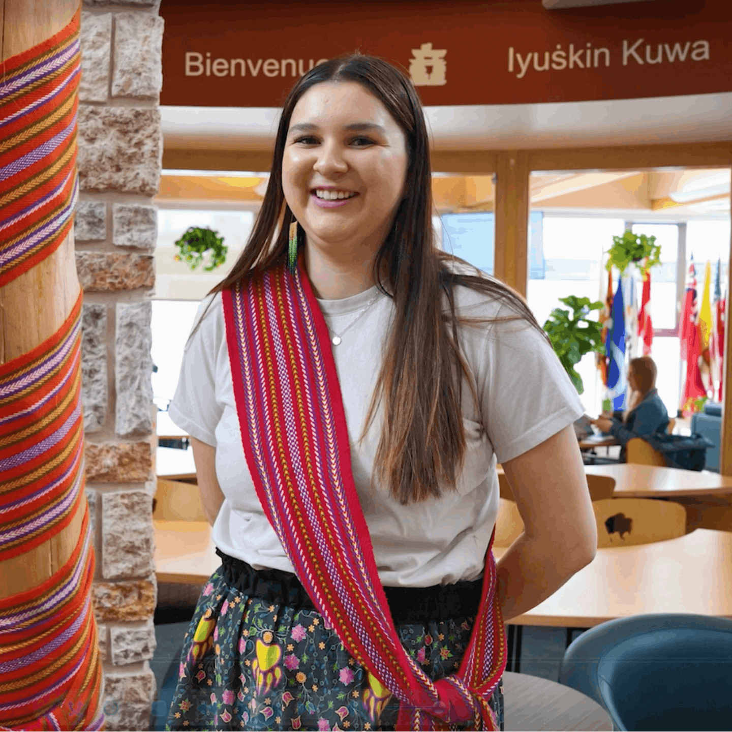 female posing with a smile inside the Indigenous student center at UM.
