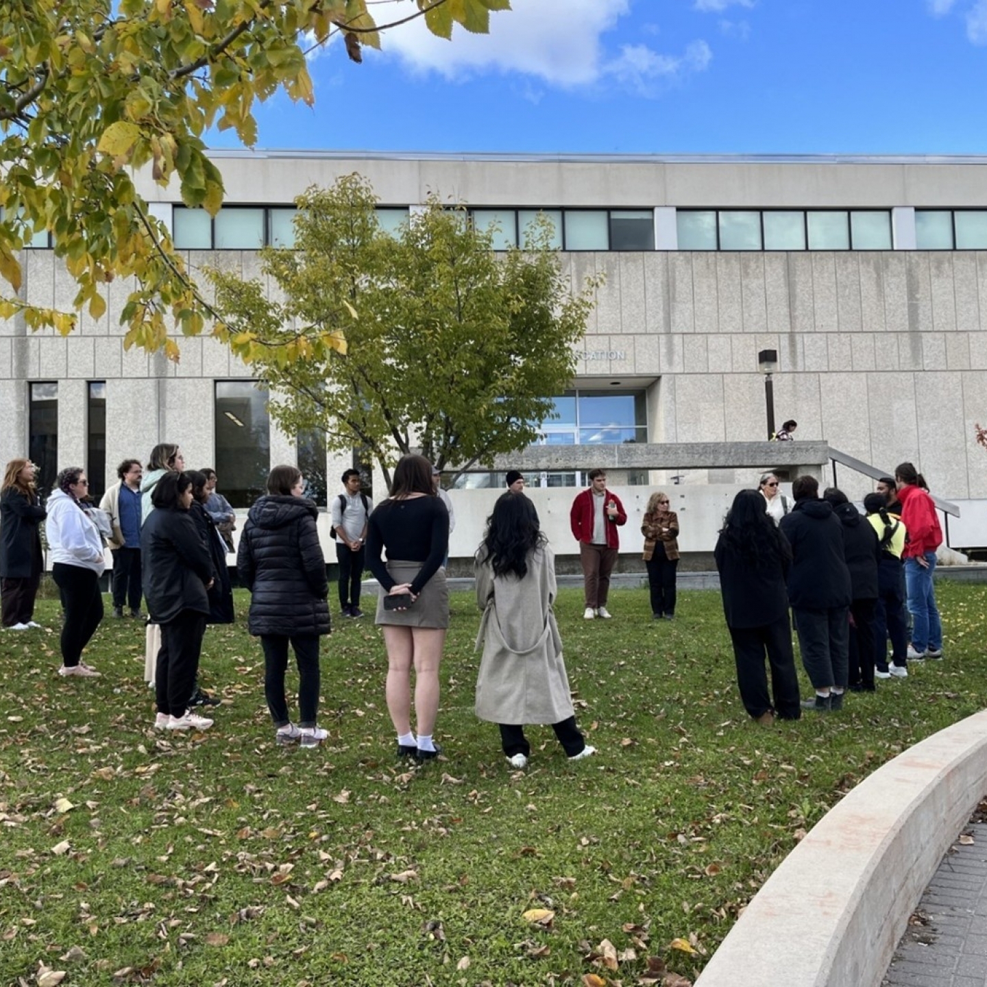 group of Indigenous students stand outside Faculty of Education building