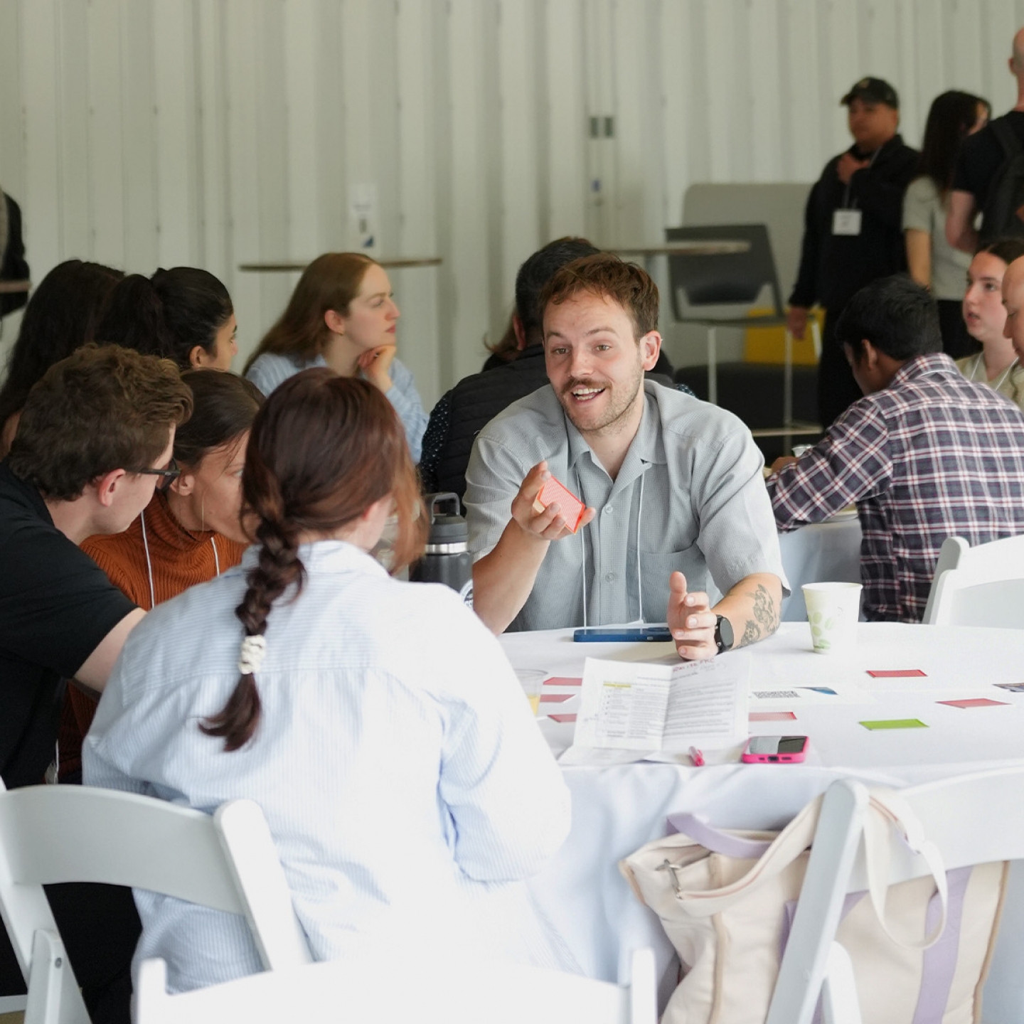 A group of students sitting at a table chatting
