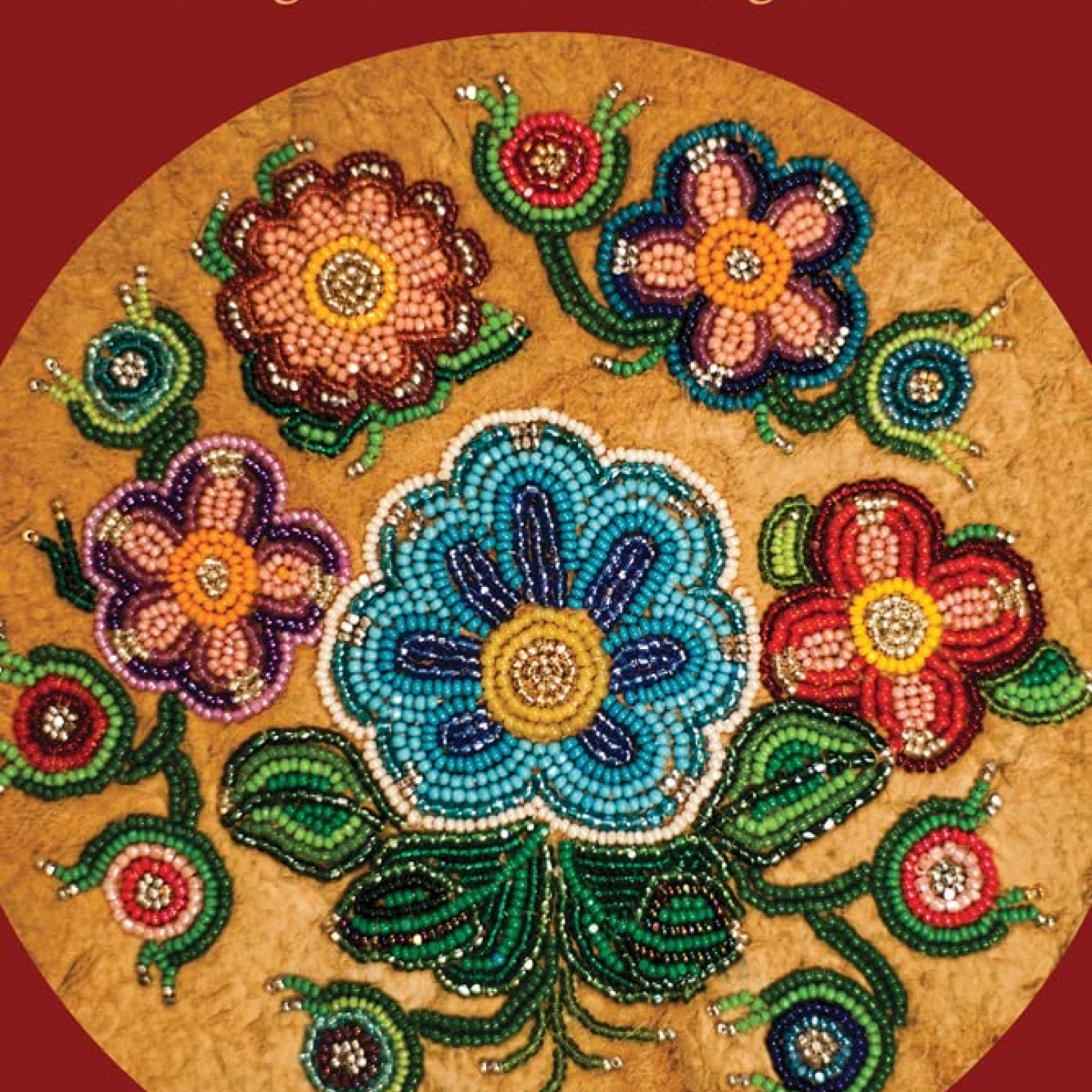 Book cover with beaded design on it