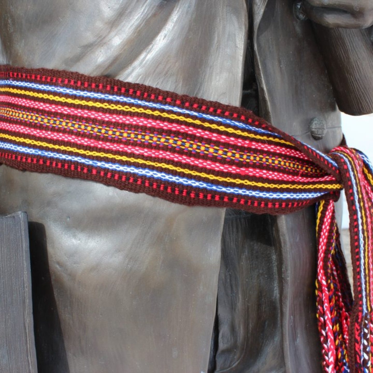 A close-up of the Louis Riel statue wearing a traditional Métis sash outside UM’s Indigenous Student Centre.