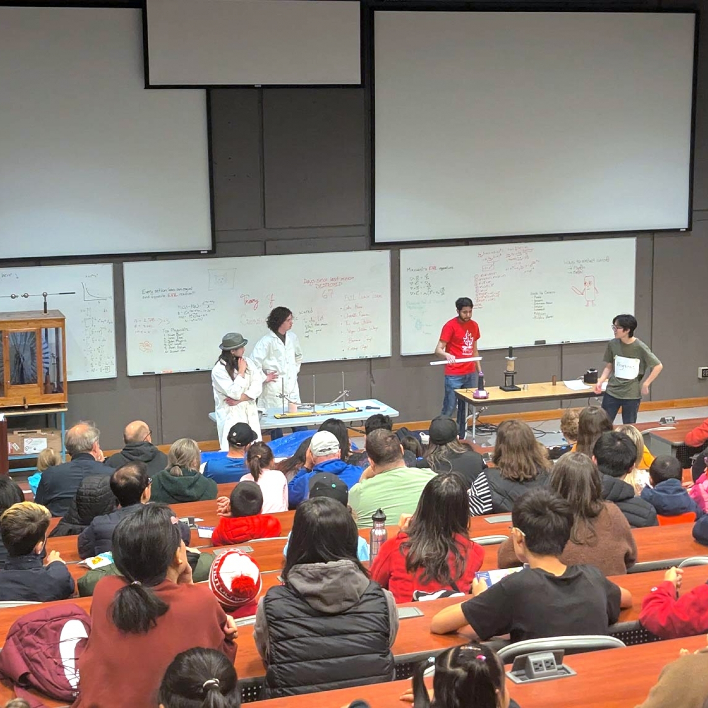 A wide shot of the attendees of the Physics show.