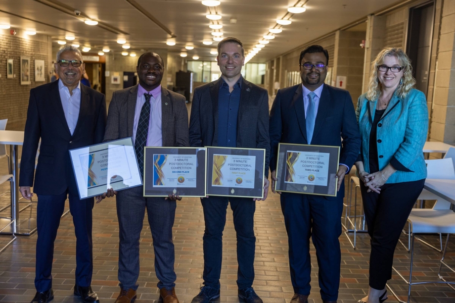 Mario Pinto and Kelley Main with winners of the 2024 Three-Minute Postdoc competition holding their certificates.