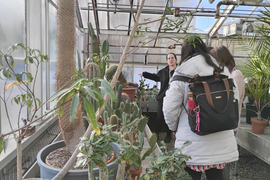 Students participate in a tour of the campus greenhouse