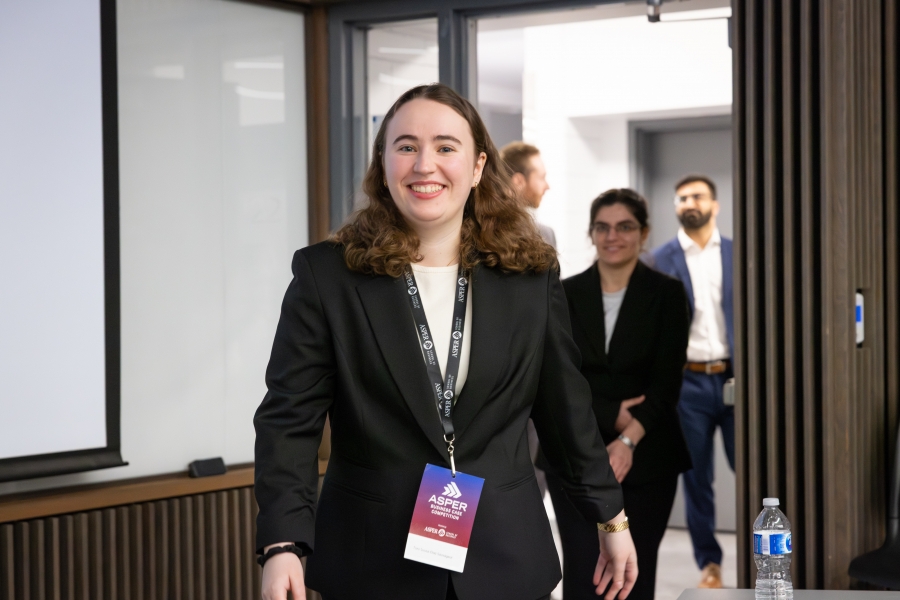 A smiling participant in the Asper Business Case Competition