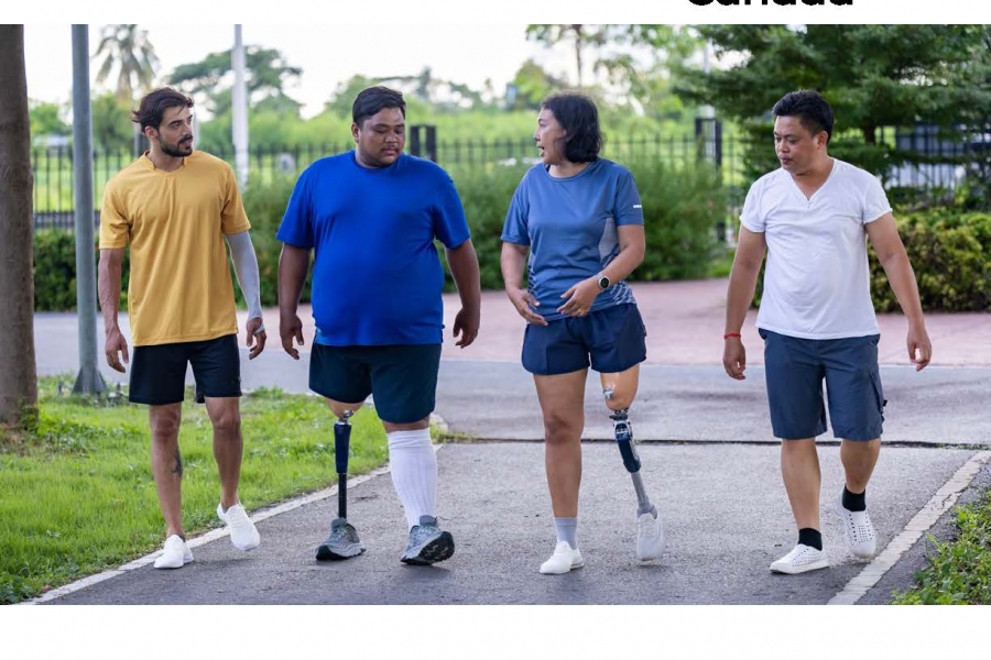 Cover image of the Municiaple Guide for Disability Inclusion in Recreation and Physical Activity Guide with an image of four people with different physical abilities walking on a paved path.