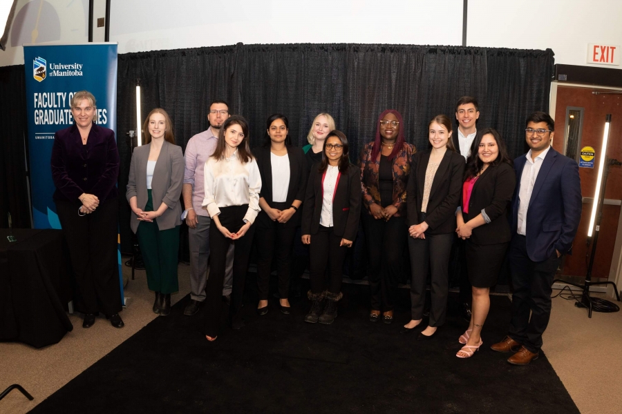 Dr. Kelley Main (L), Dean of the Faculty of Graduate studies, stands with challengers from the 2023 3MT Final event.