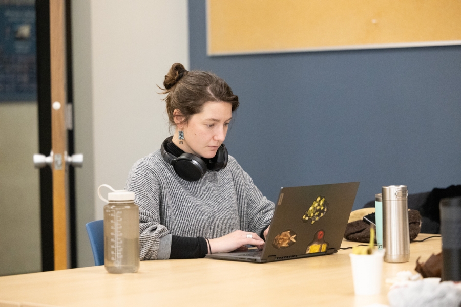 Graduate Sutdent working on thesis in retreat