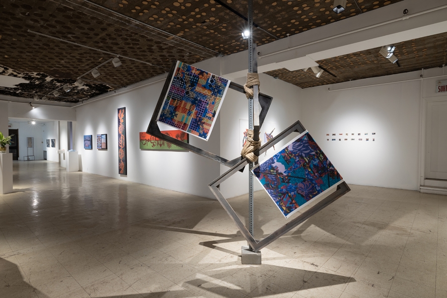Suspended steel frame sculpture displaying two vibrant patterned prints by School of Art alum Deinma Iyagba (BFA Hon. ’24) at Art Mûr, 2024.