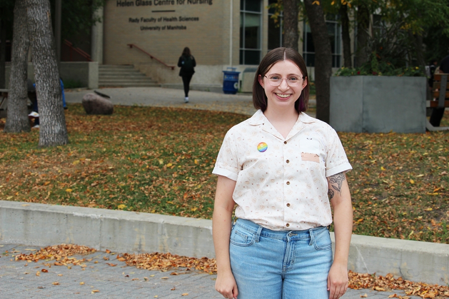 Ashley Bell standing outside of the Helen Glass Centre for Nursing.