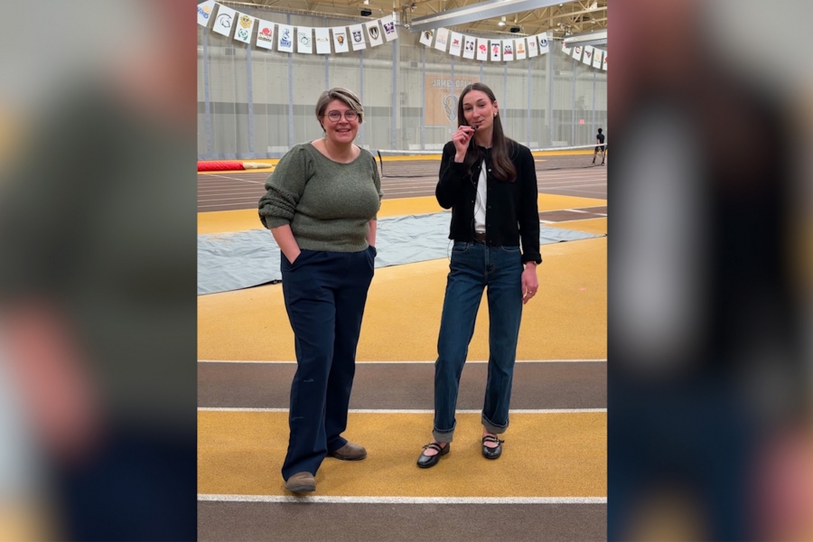 Dr. Mandi Baker and Kendall Mariott standing on the track during an interview