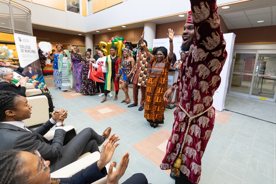 A group of students from the College of Nursing perform in a cultural attire fashion show at the Helen Glass Centre for Nursing atrium.