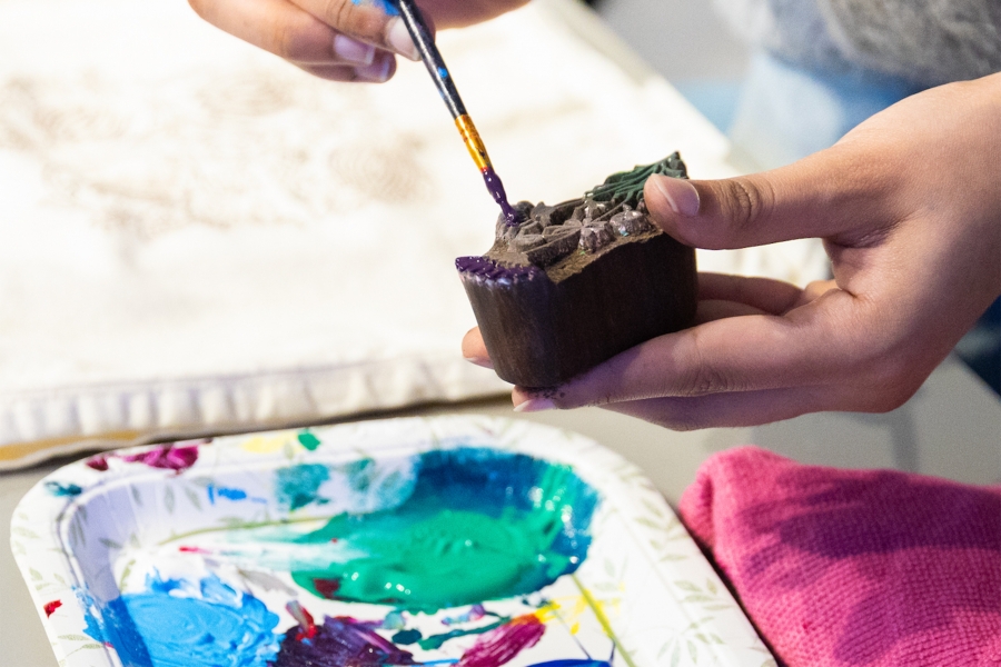 Ebunoluwa Akinbo painting a carved blocked to do block printing