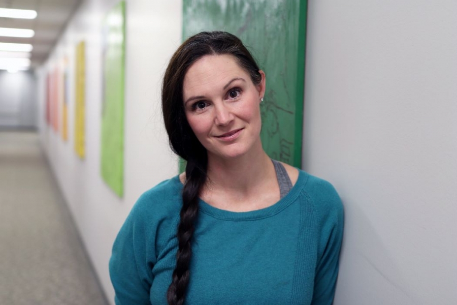 Dr. Laura Bowler stands in a hallway at the University of Manitoba.