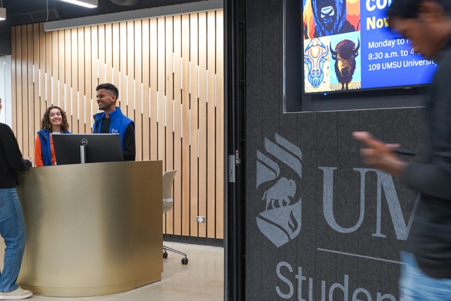 Connection desk staff helping students at the Connection Desk