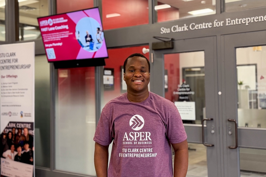 Eniola Osabiya in front of Stu Clark Centre