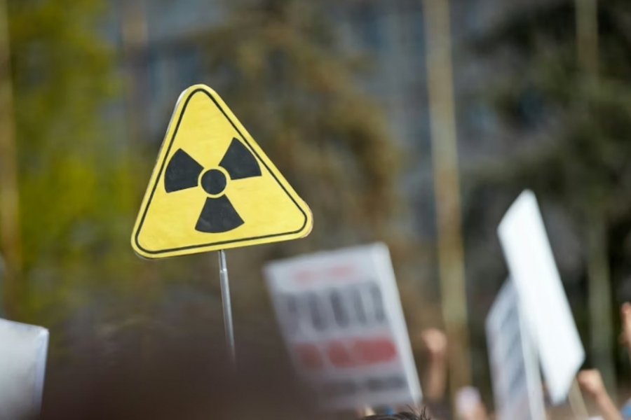 Road sign with hazard symbol