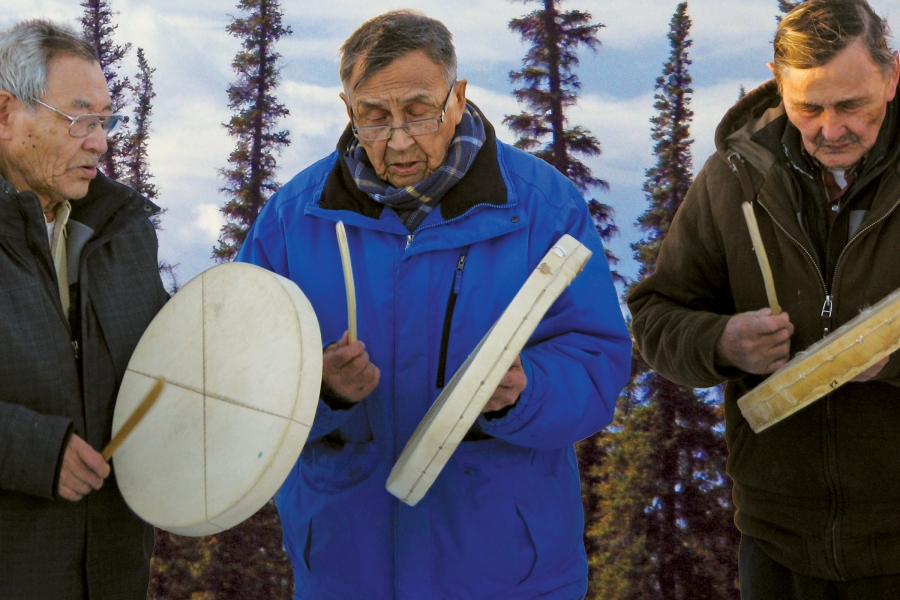 Three people side by side with Indigenous hand drums