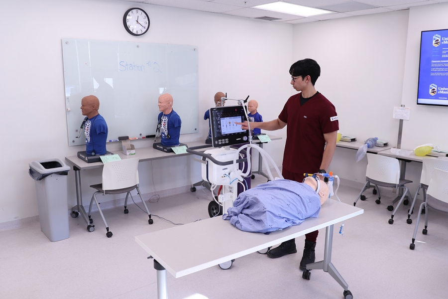 Jerick Dela Cruz working in a respiratory therapy lab.