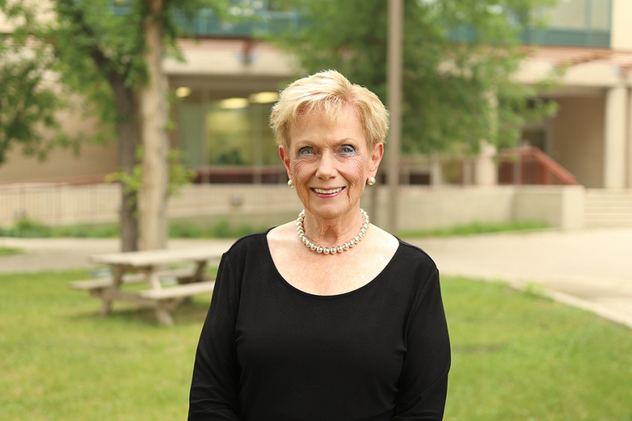 Judith Scanlan stands outside at Fort Garry campus. 