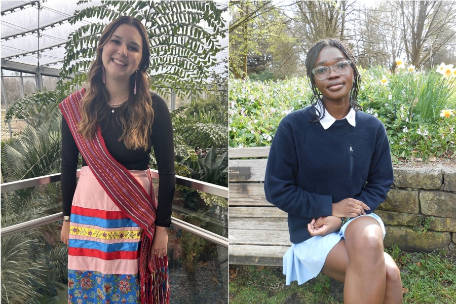 Two females side by side, one in a ribbon skirt, one in a sweater, collared shirt and skirt. 