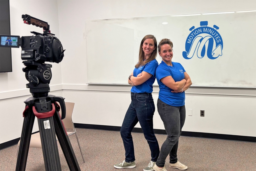 two women posing to a camera