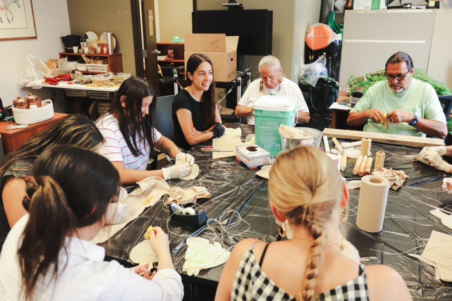 A group of people making rattles.